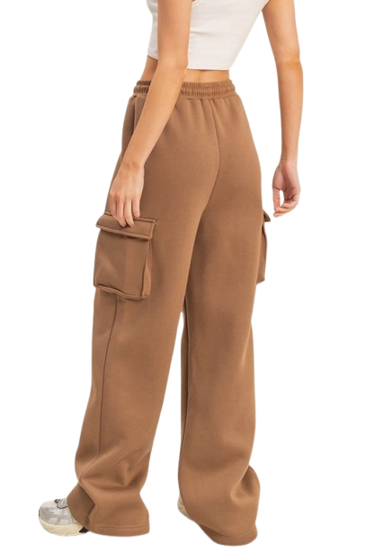 Brown cargo pants worn by a person on a white background